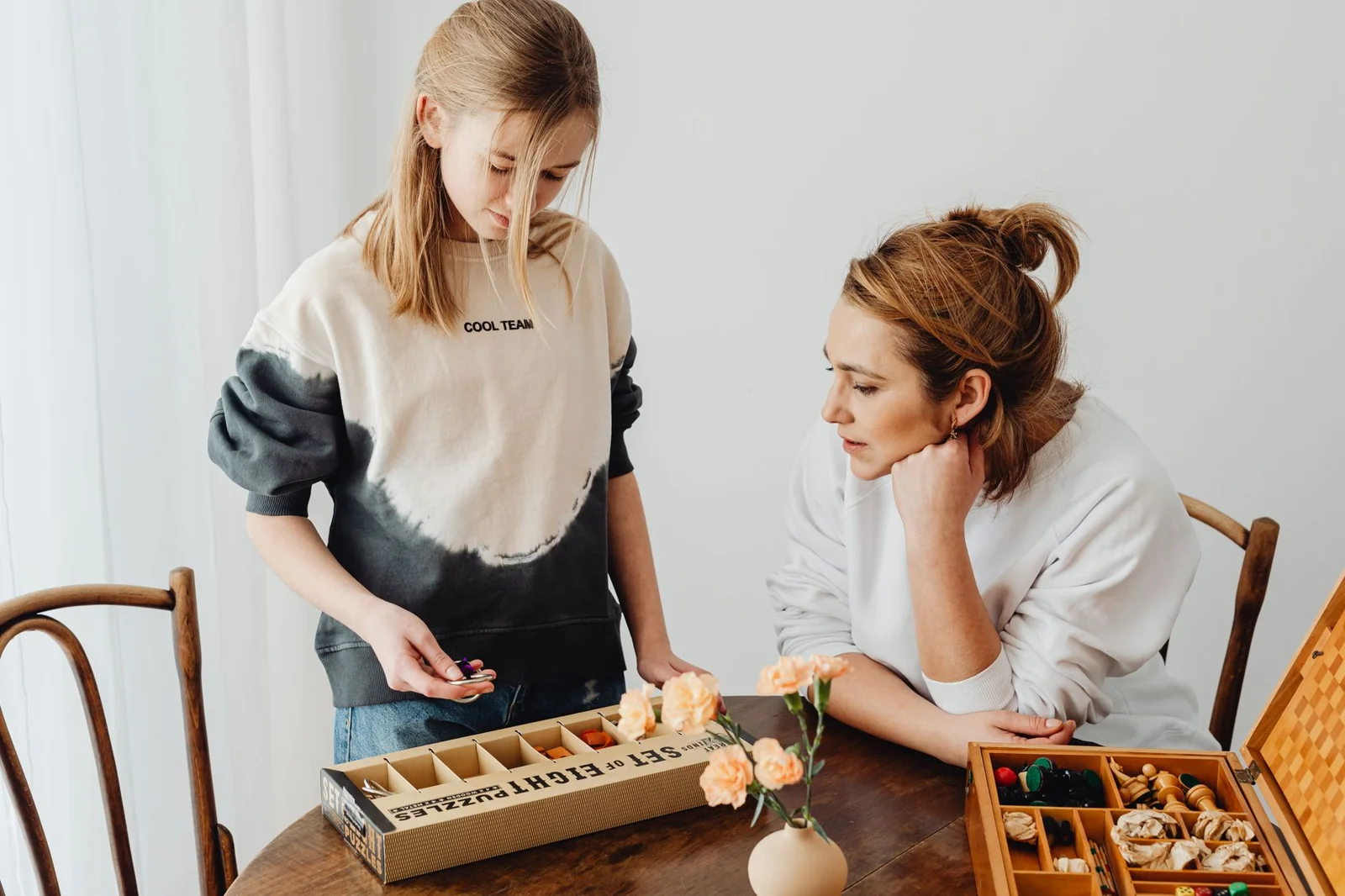 Two people cooking together at a table
