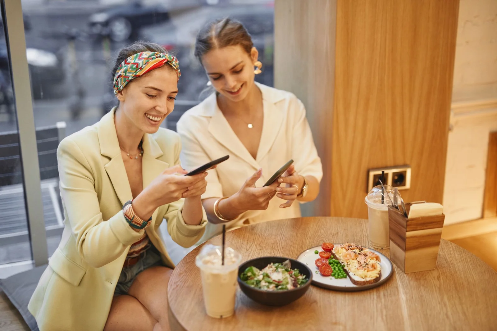 Women friends laughing at a brunch table