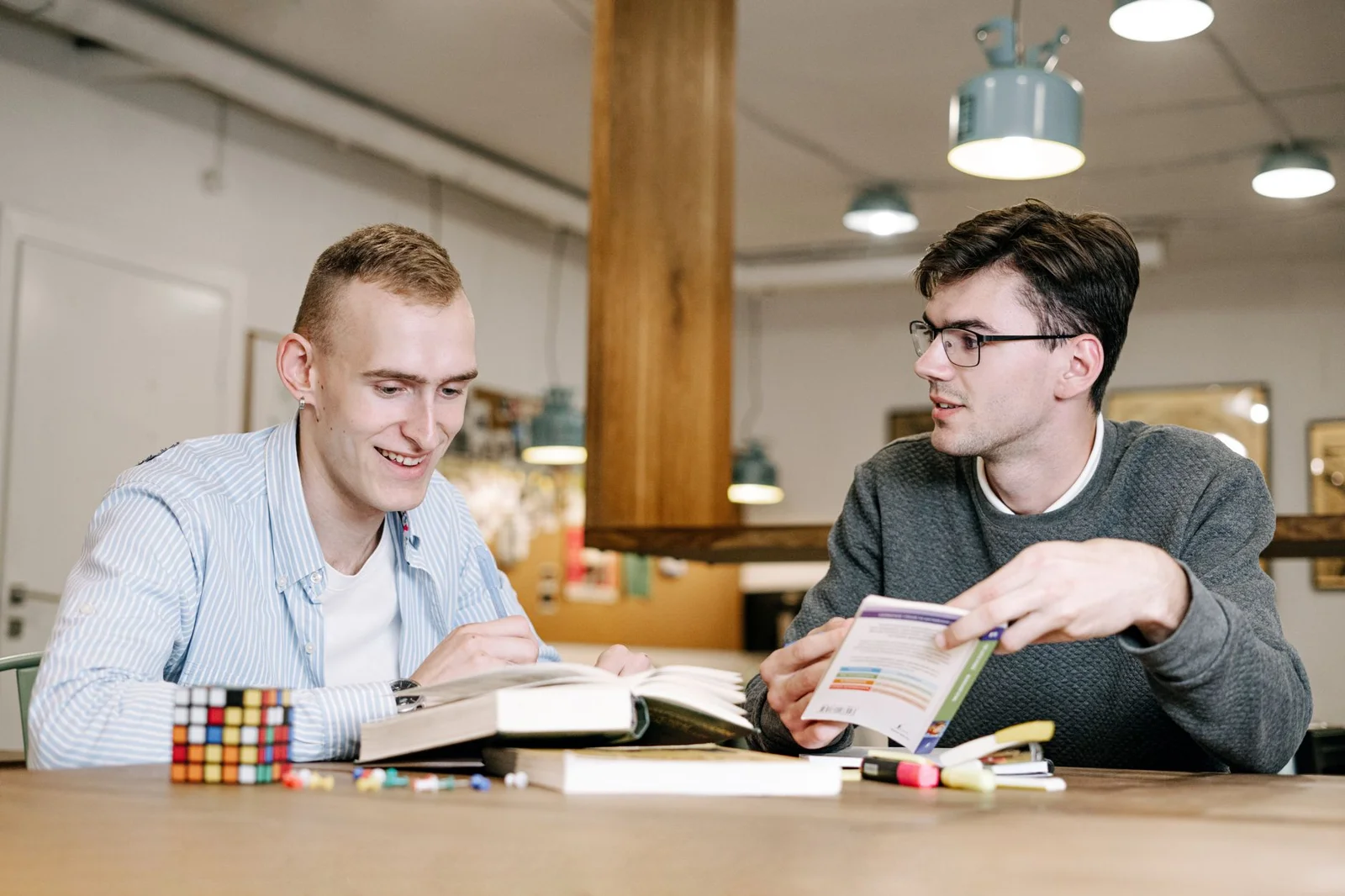 Men working through a challenge together